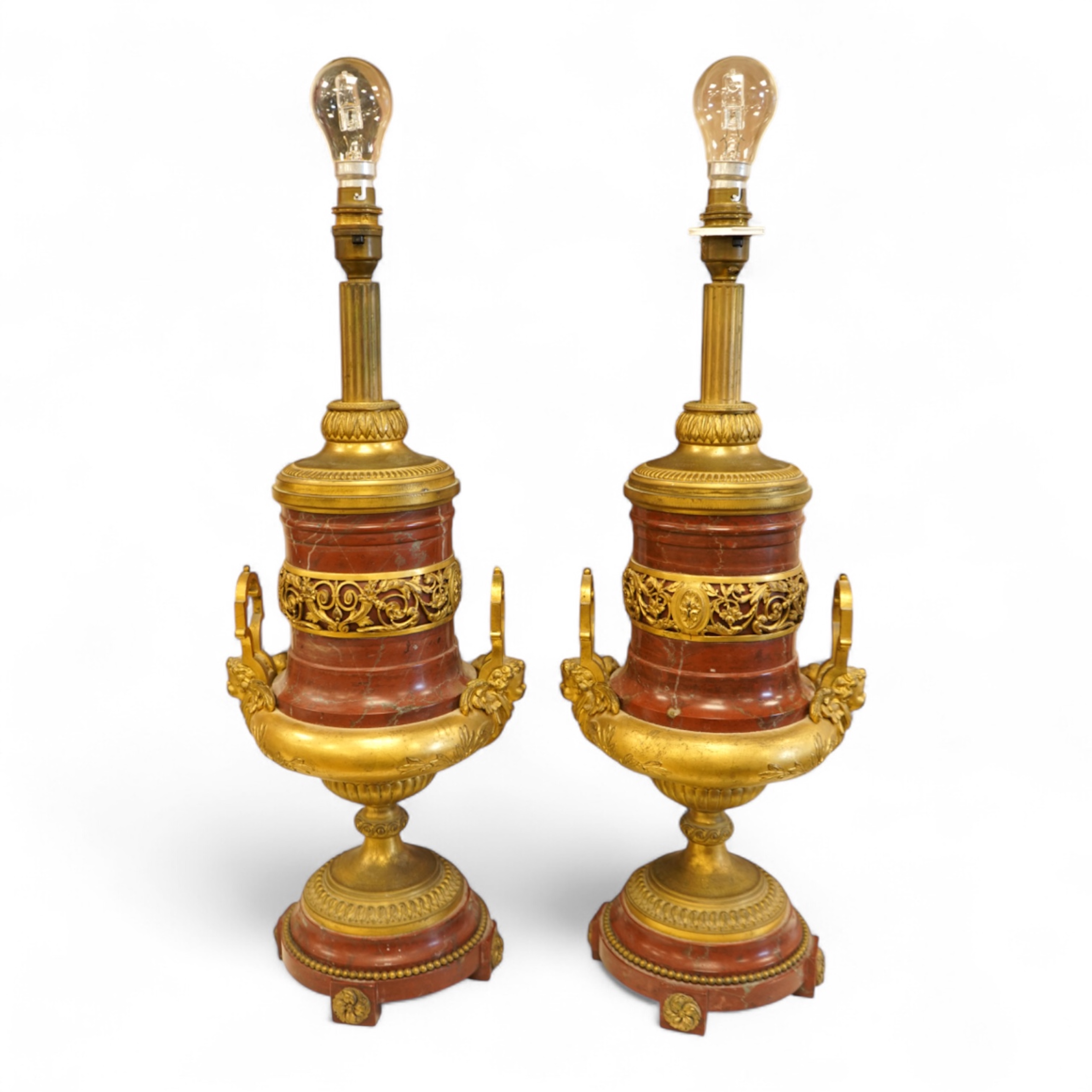 A pair of Empire style gilt metal and rouge marble table lamps, 50cm